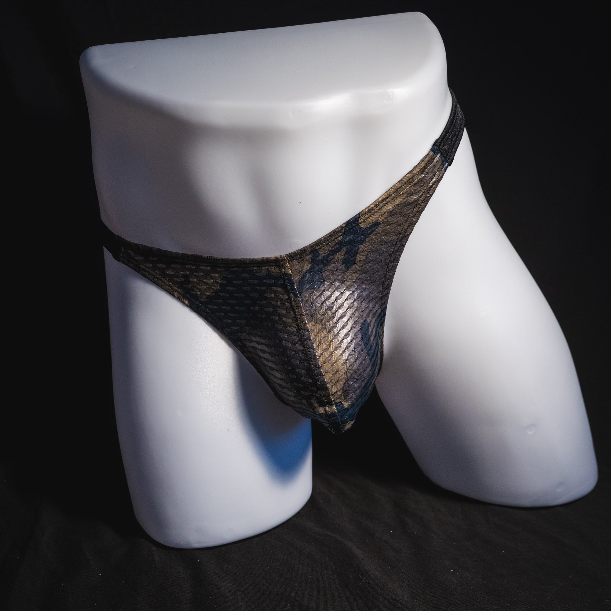 Men's dark camo athletic mesh thong underwear, classic cut, full front view.