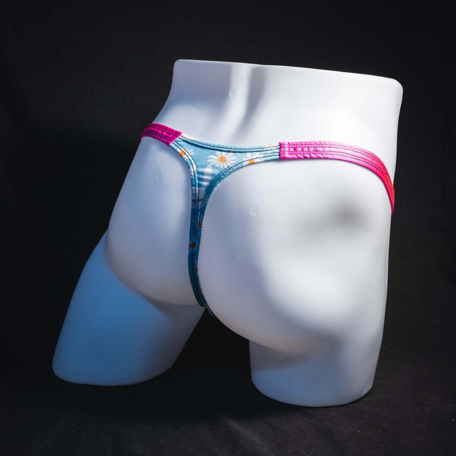 Men's easter bunnies thong underwear, classic cut, full angled rear view.