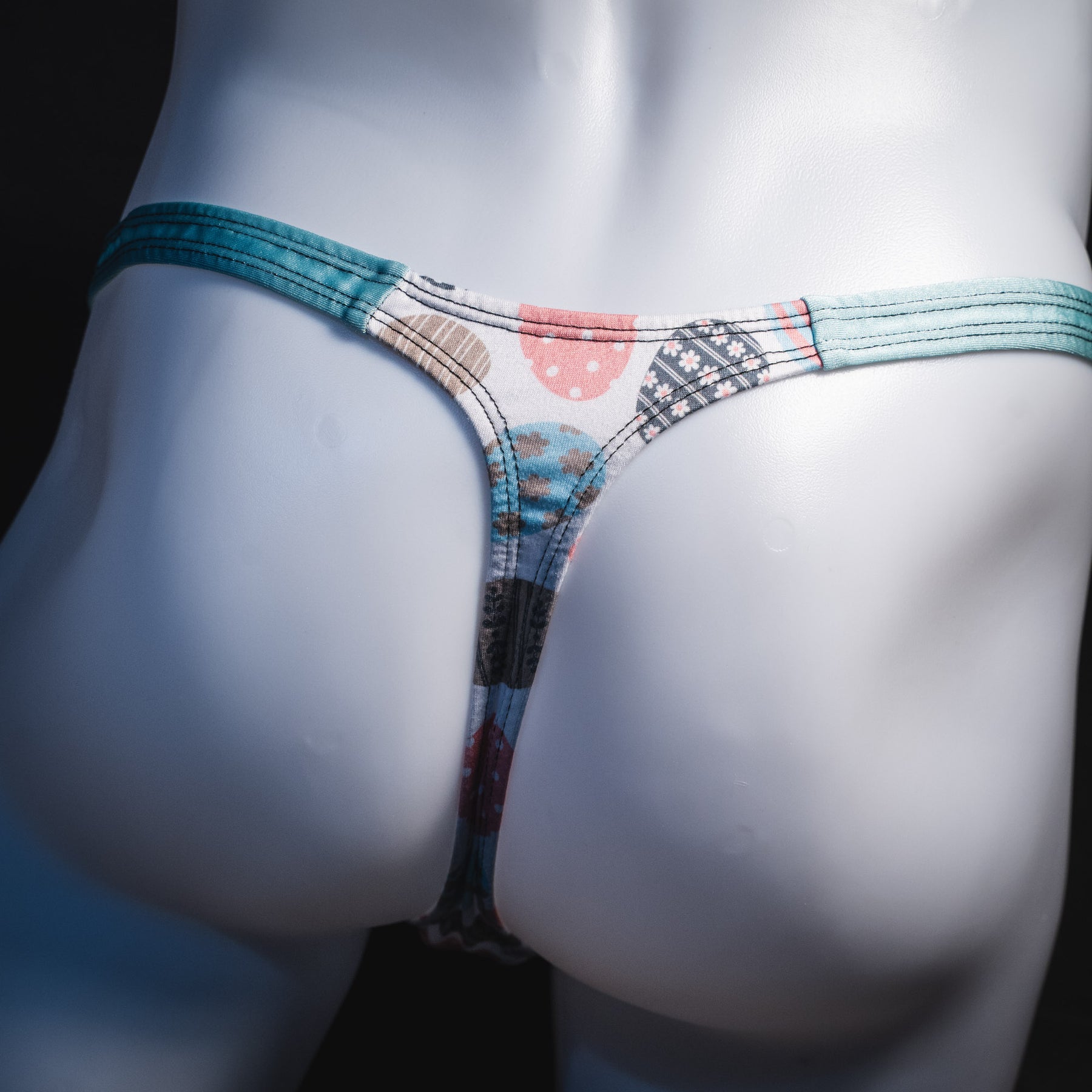 Men's Easter eggs thong underwear, classic cut, rear view.