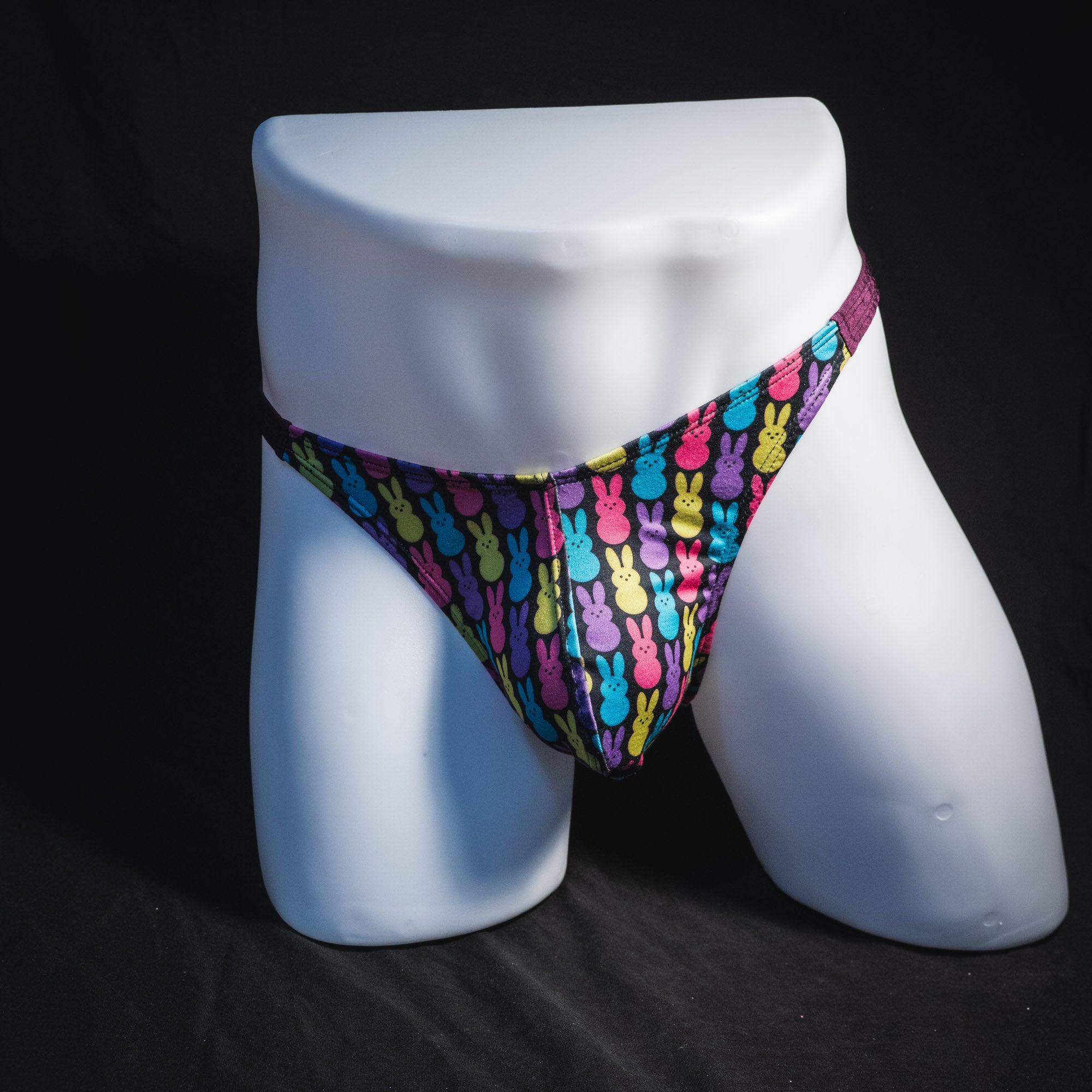 Men's colorful bunnies thong underwear, classic cut, full front view.