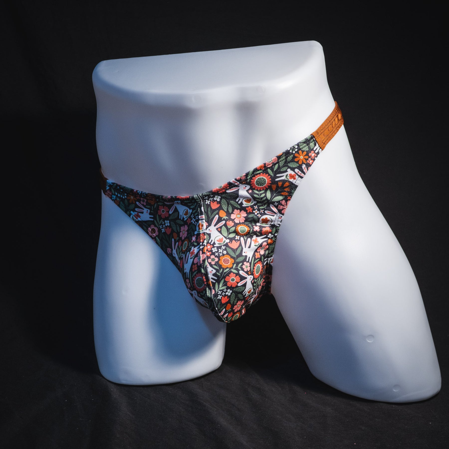 Men's easter themed thong underwear, classic cut, full front angled view.