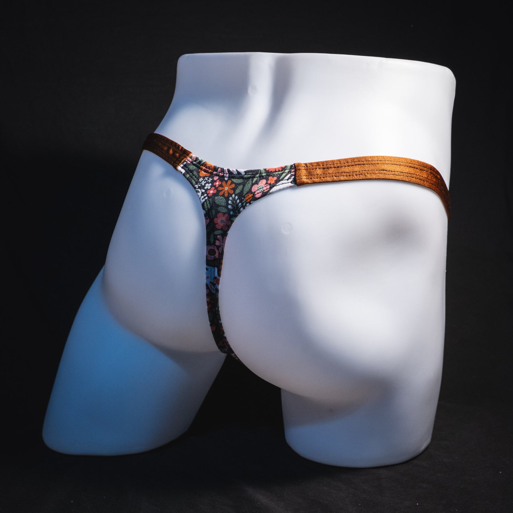 Men's easter themed thong underwear, classic cut, full rear angled view.