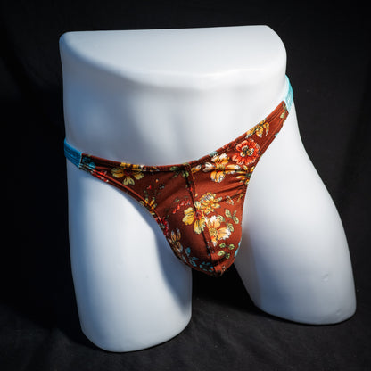 Men's floral thong underwear, classic cut, front view.