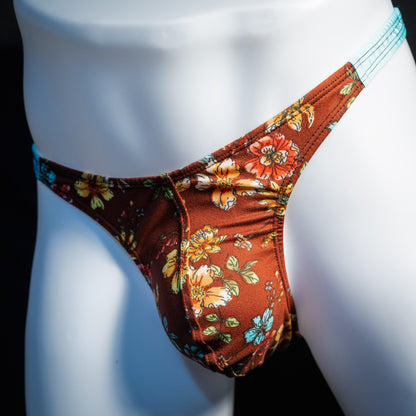Men's floral thong underwear, classic cut, front view.