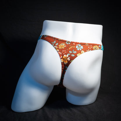 Men's floral thong underwear, classic cut, back view.