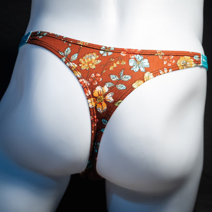 Men's floral thong underwear, classic cut, back view.