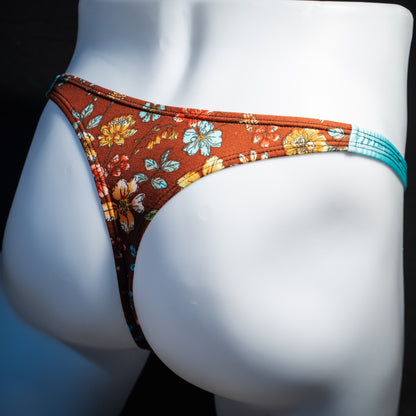 Men's floral thong underwear, classic cut, back view.