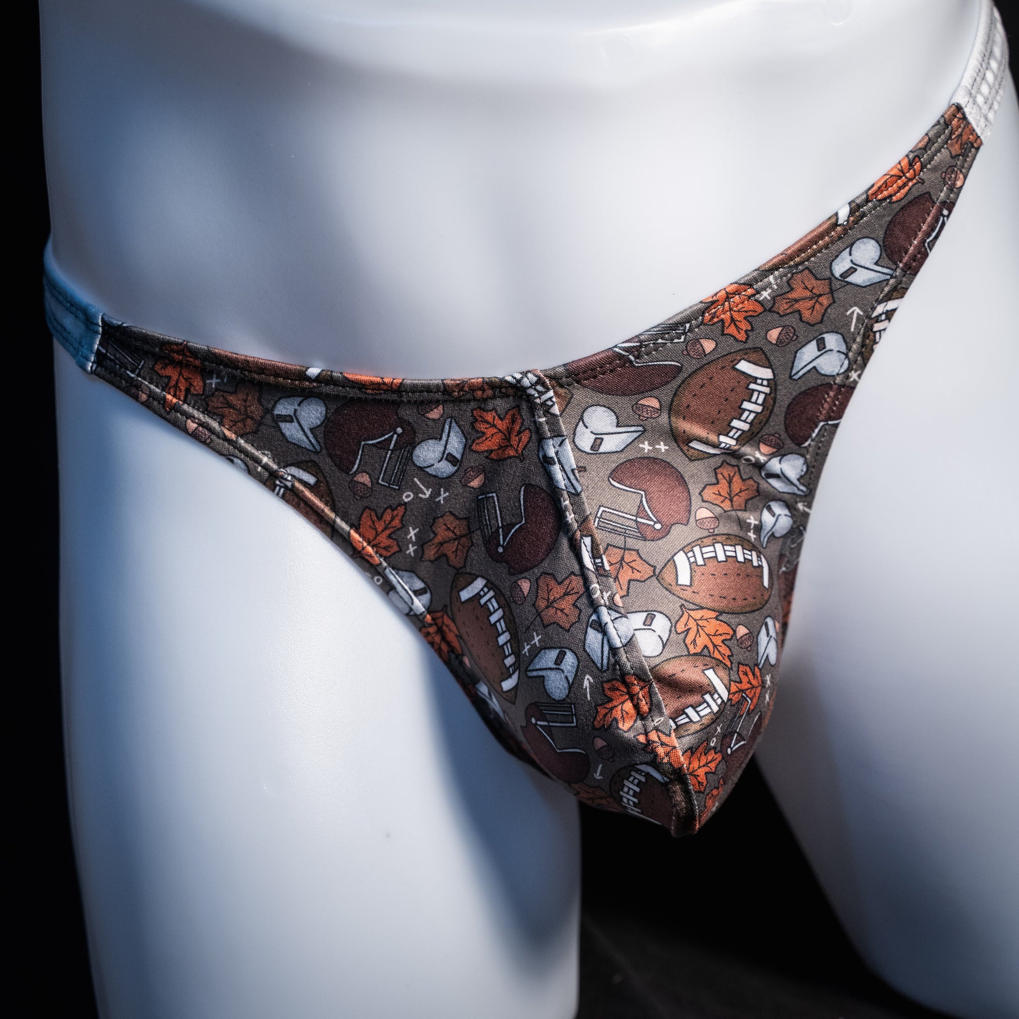 Men's football themed thong underwear, classic cut, front view.
