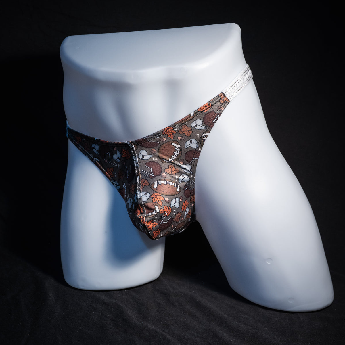 Men's football themed thong underwear, classic cut, front view.