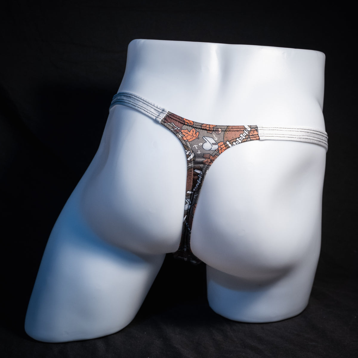 Men's football themed thong underwear, classic cut, rear view.