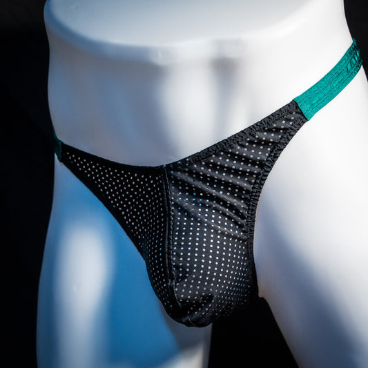 Men's mesh and forest green thong underwear, classic cut, angled front view.