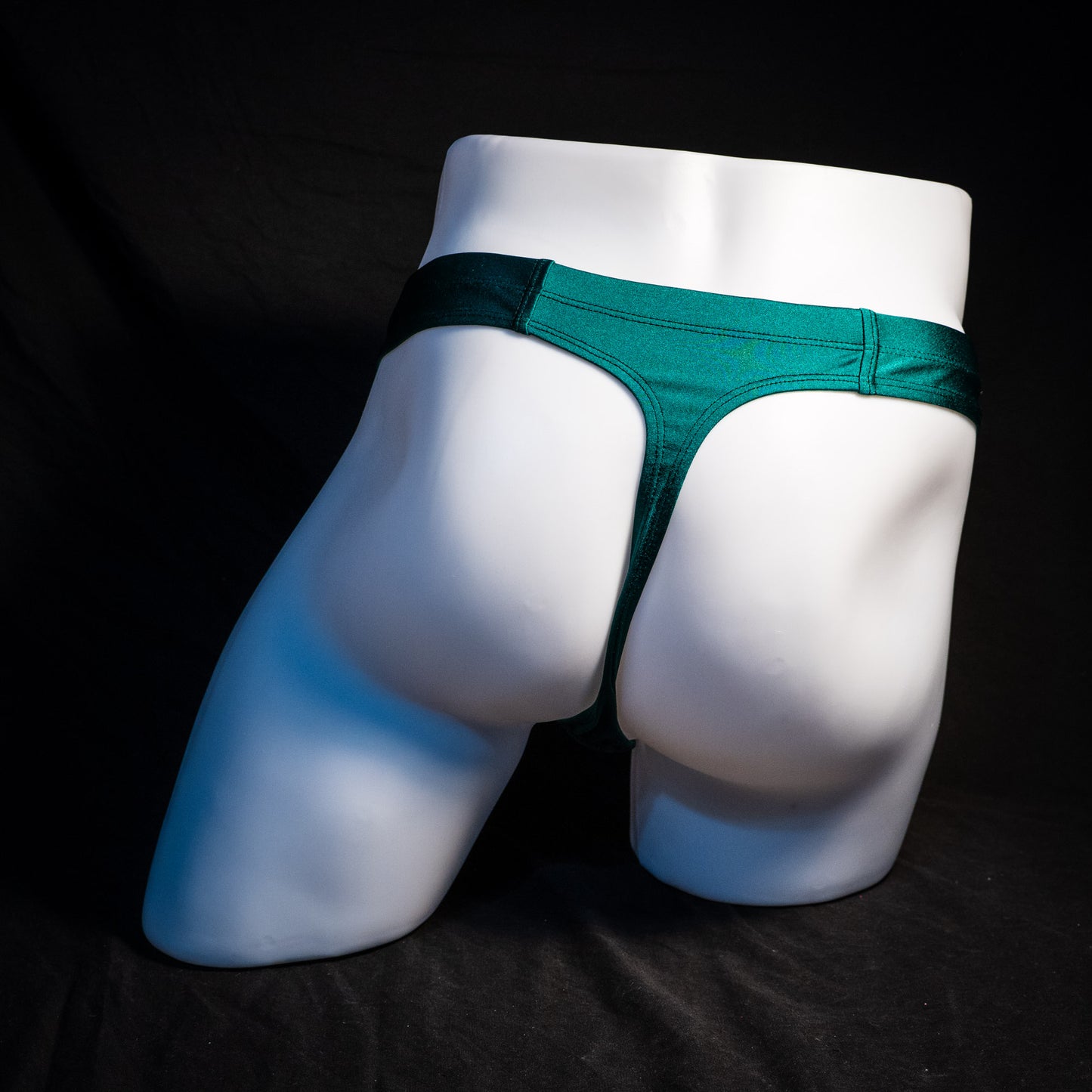 Men's pouchless forest green thong underwear, Full rear view