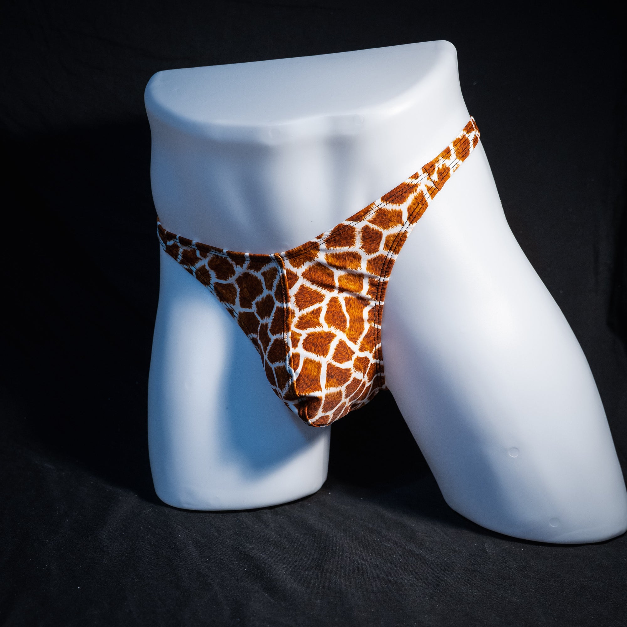 Men's giraffe print thong underwear, classic cut, front view.