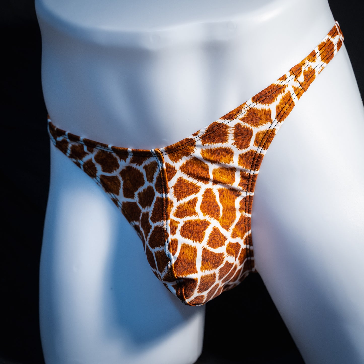 Men's giraffe print thong underwear, classic cut, front view.