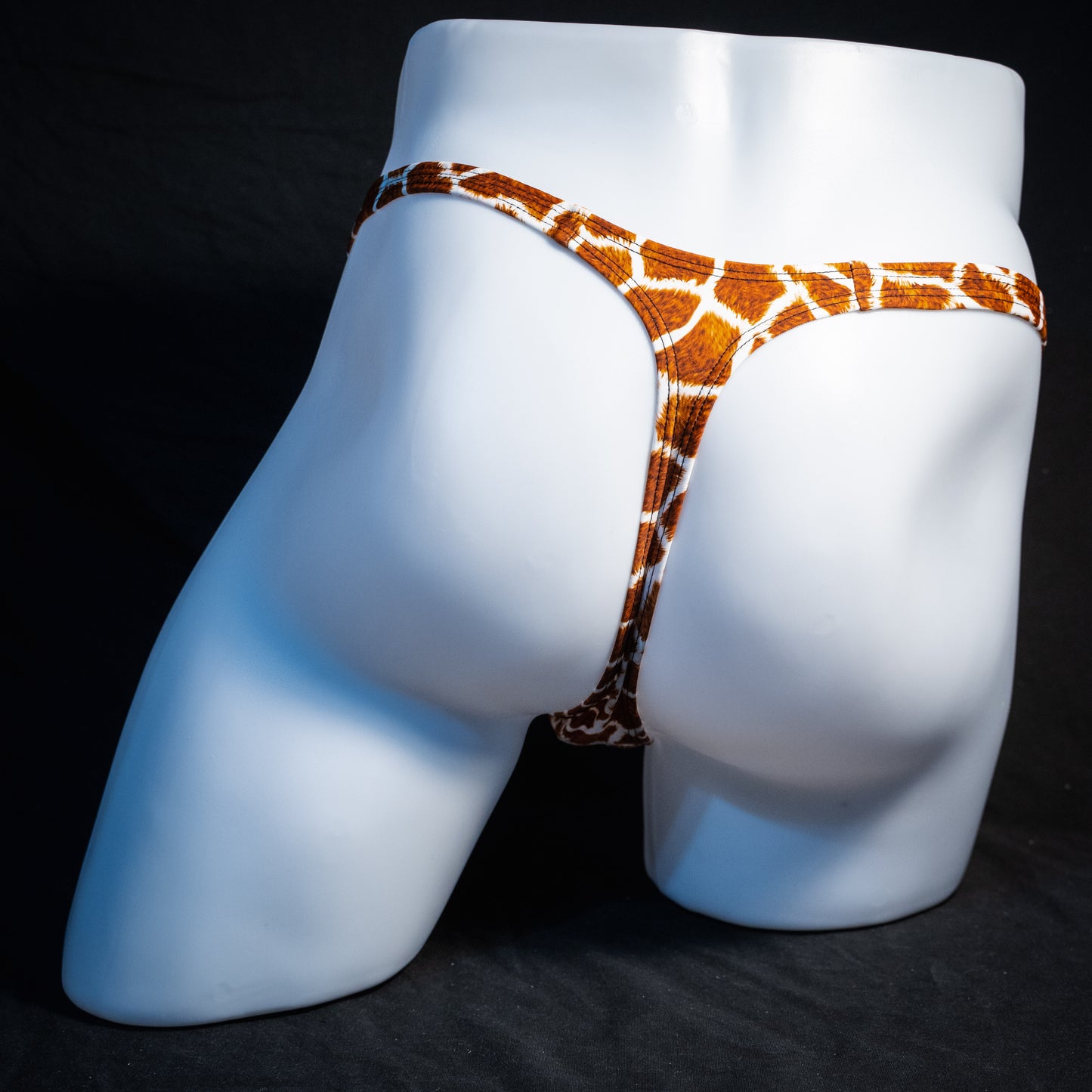 Men's giraffe print thong underwear, classic cut, rear view.