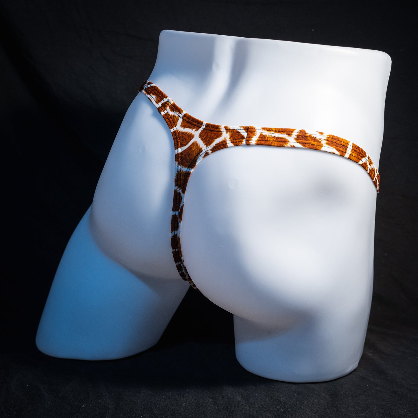 Men's giraffe print thong underwear, classic cut, rear view.
