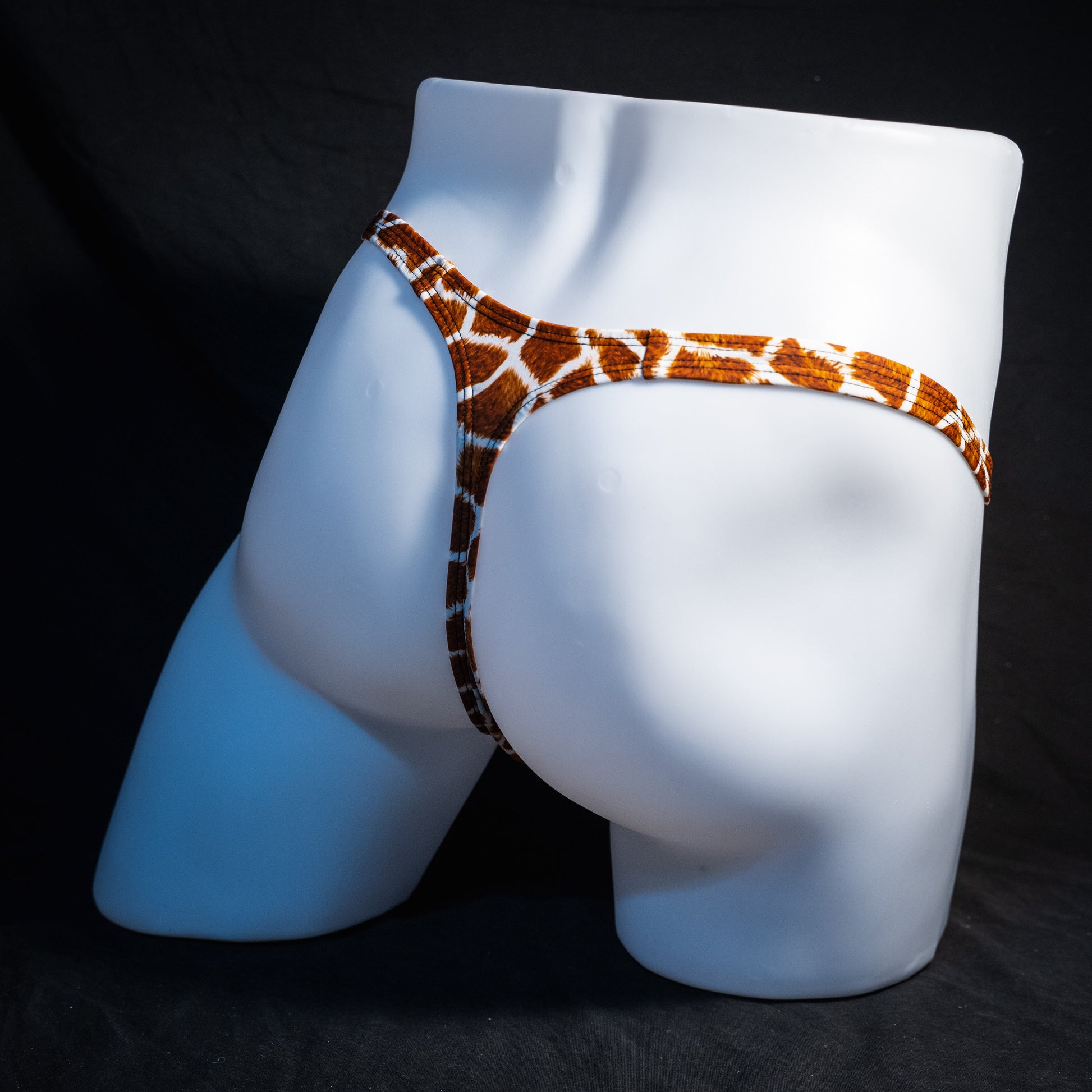 Men's giraffe print thong underwear, classic cut, rear view.
