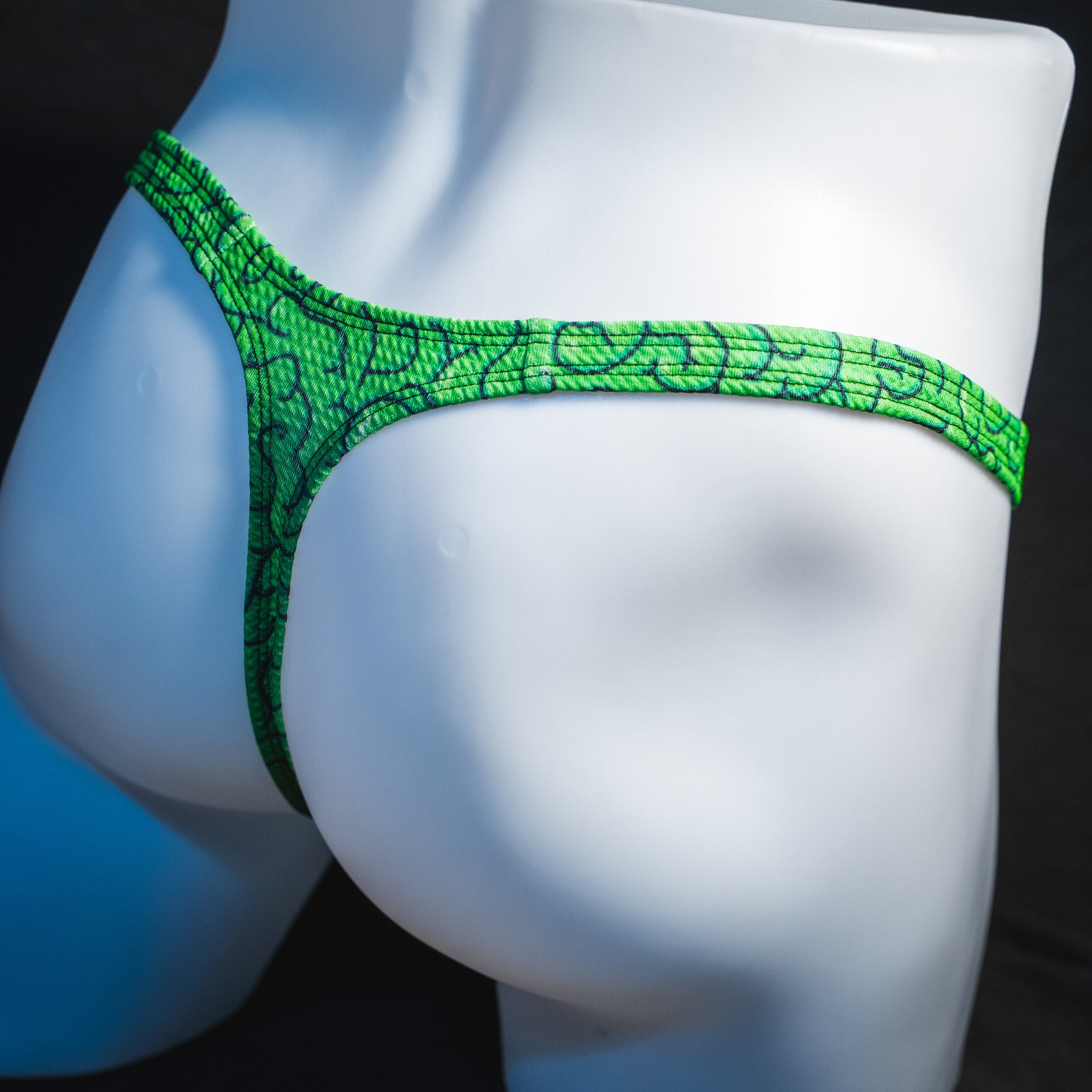 Men's green brains thong underwear, classic cut.