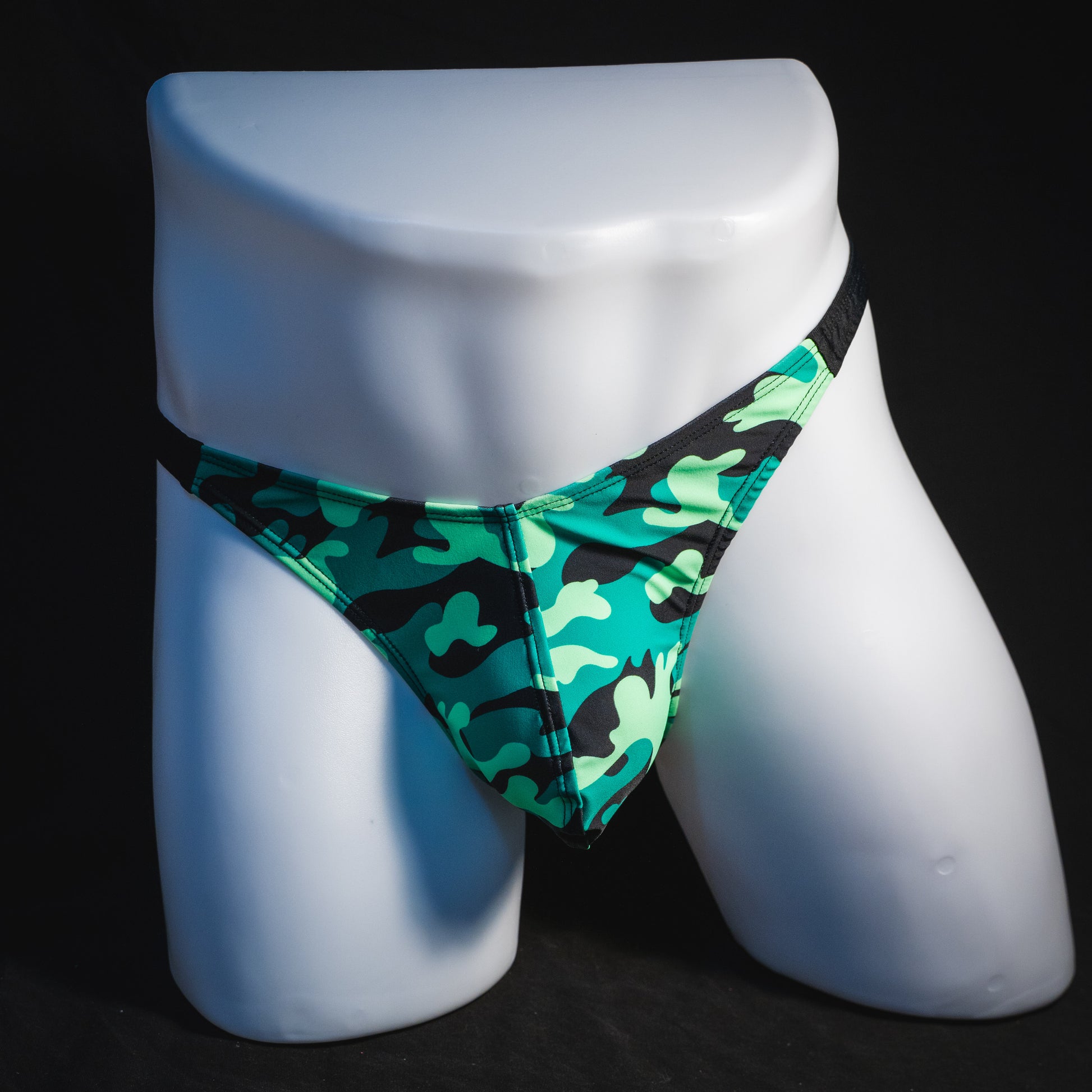 Men's green camo with black straps thong underwear, classic cut, full front view.
