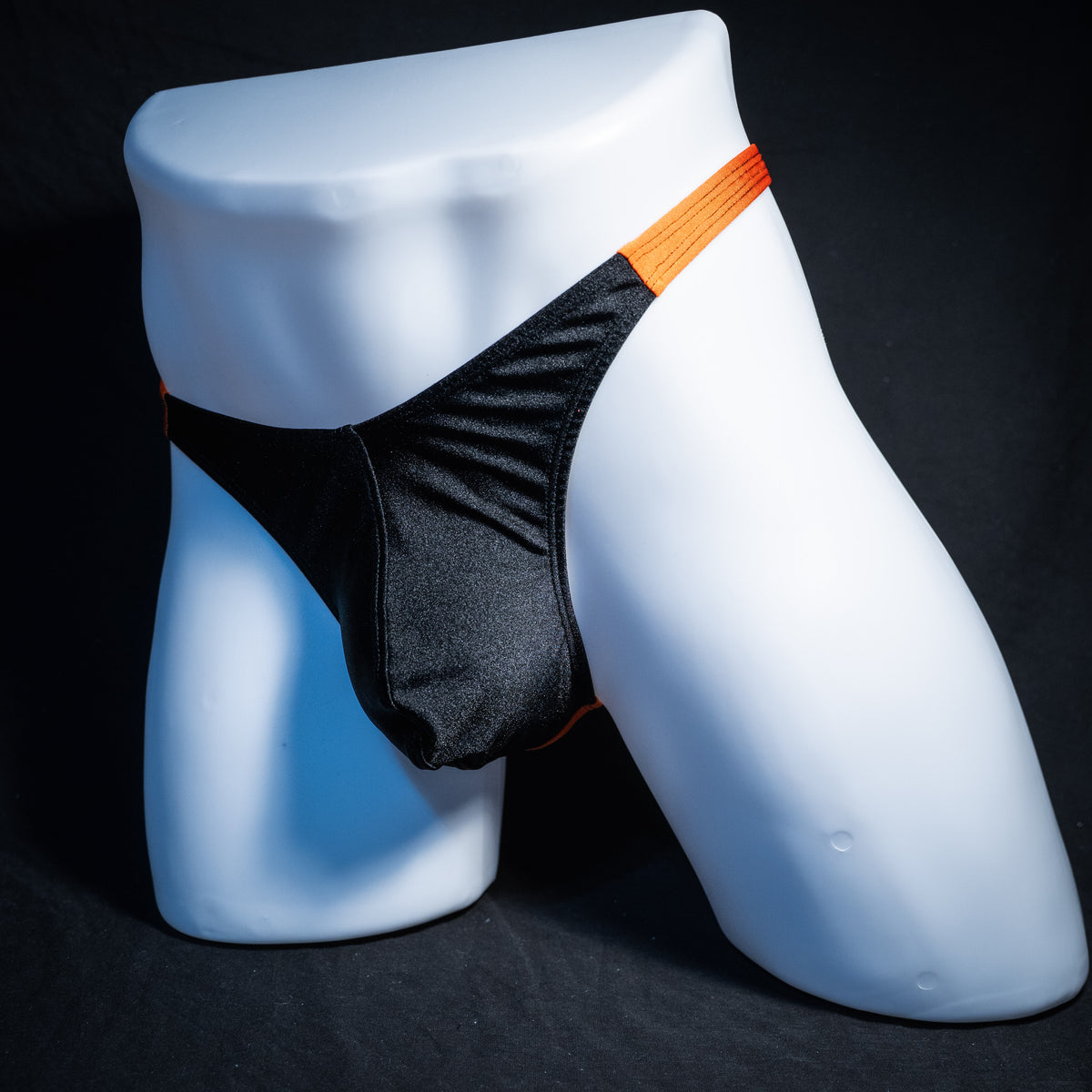 Men's Halloween black and orange thong underwear, classic cut, front view.