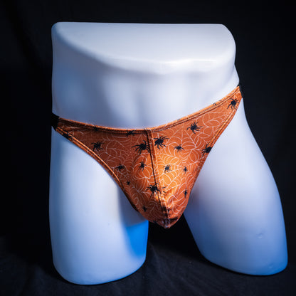 Men's Halloween spider webbed themed thong underwear, classic cut, front view.