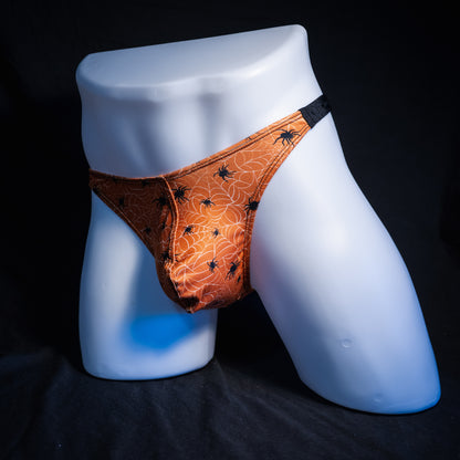 Men's Halloween spider webbed themed thong underwear, classic cut, front view.