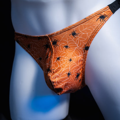 Men's Halloween spider webbed themed thong underwear, classic cut, front view.