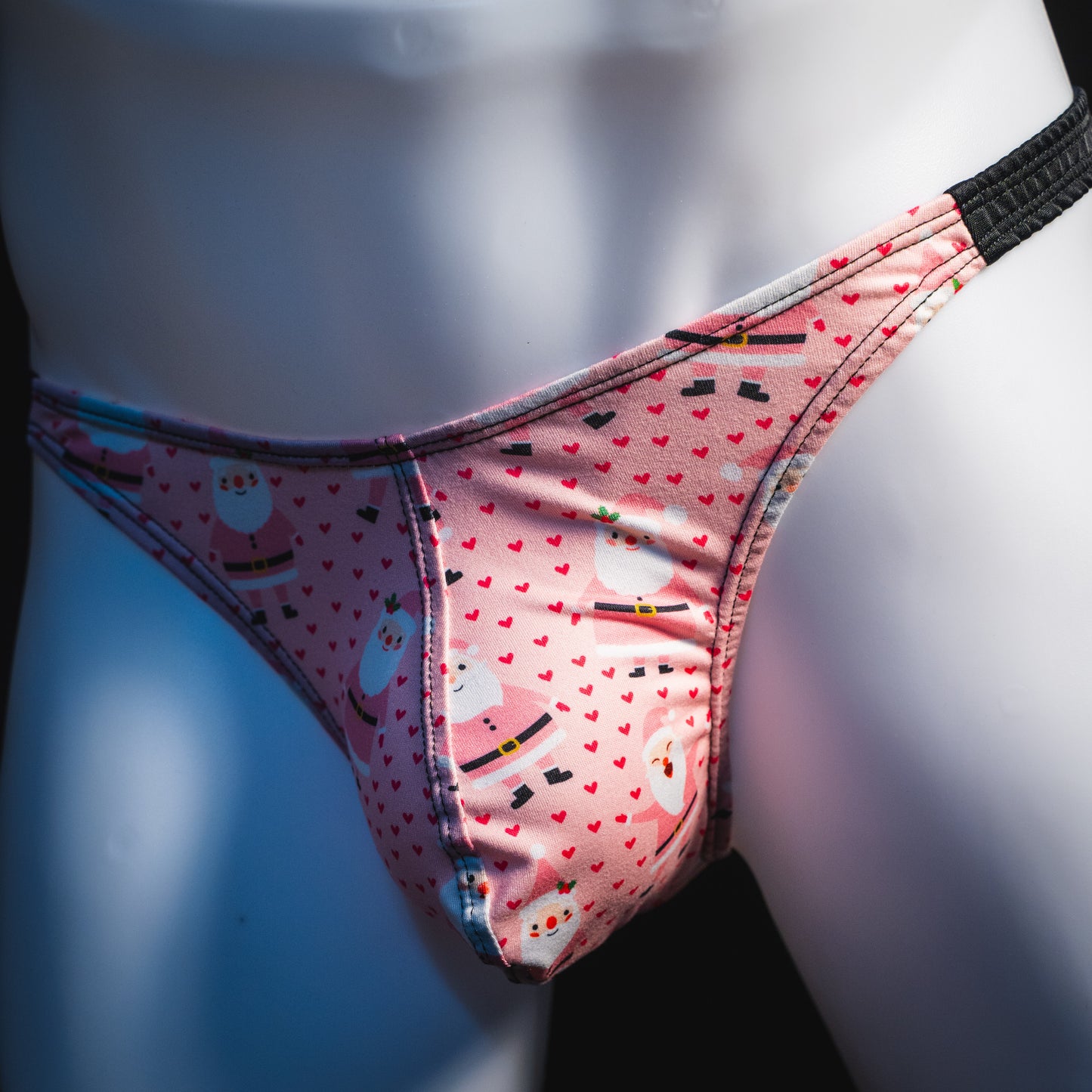 Men's happy Santa's thong underwear, classic cut, front angled view.