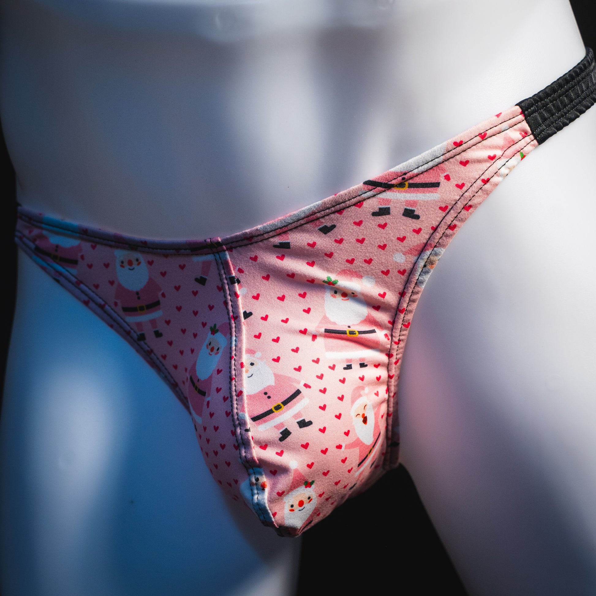 Men's happy Santa's thong underwear, classic cut, front angled view.