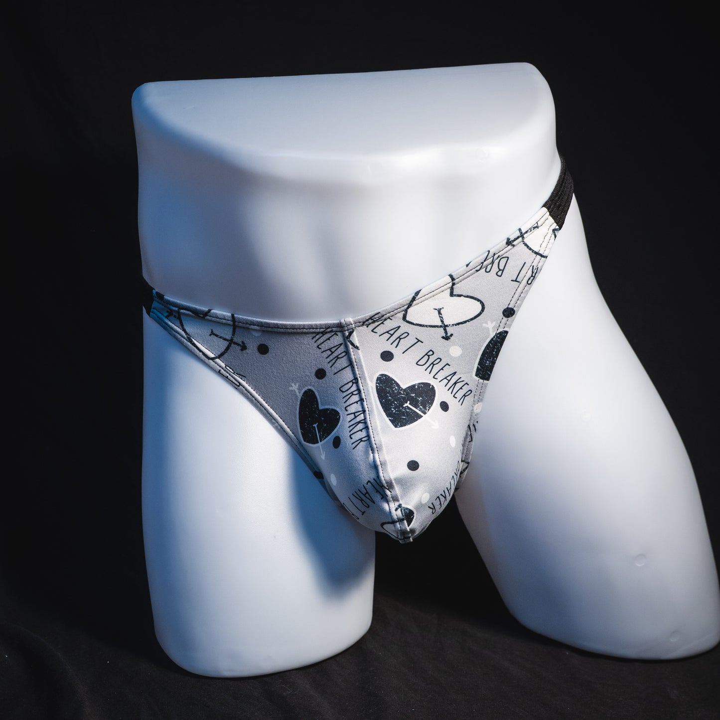 Men's black and white Valentine's Day thong underwear, Classic cut, full front view.