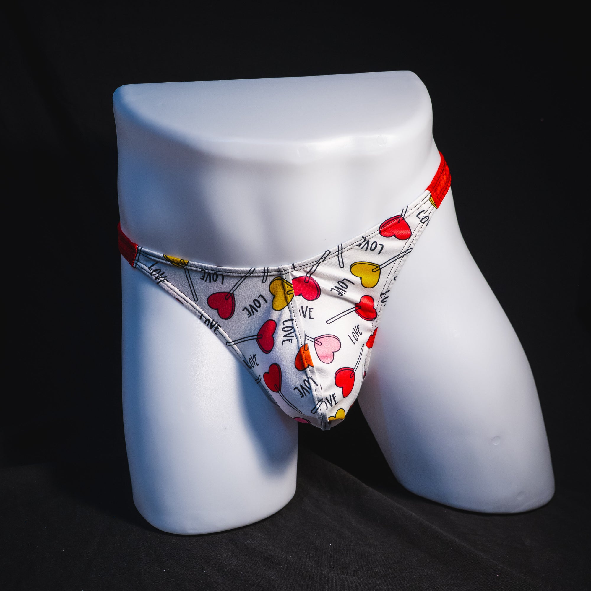 Men's heart shaped lollipops thong underwear, classic cut, full front view.