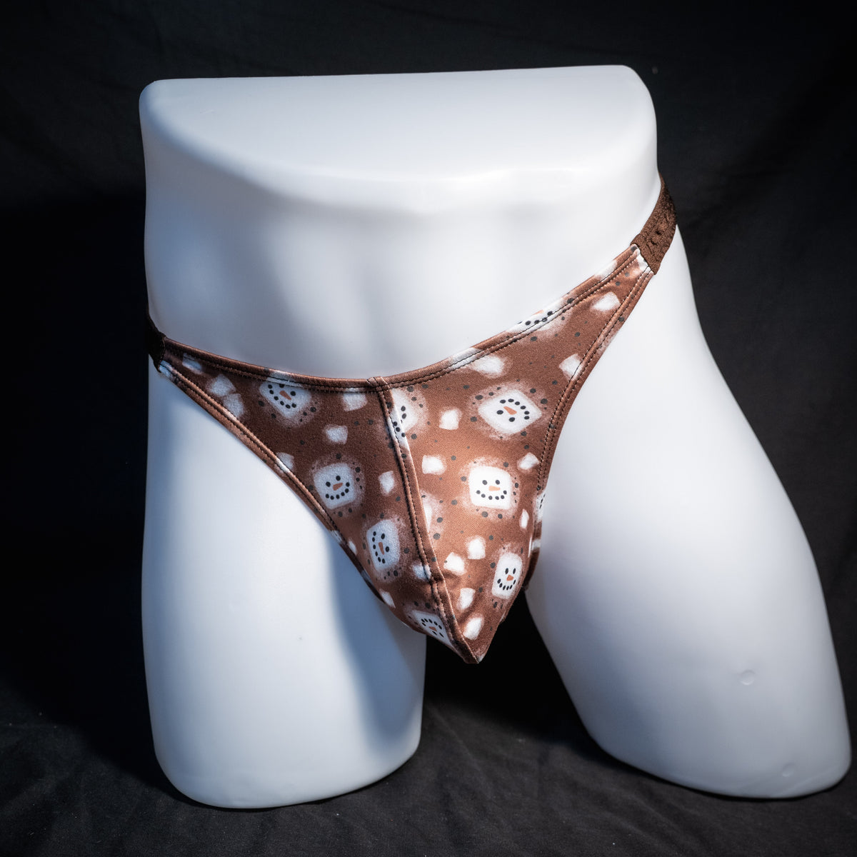 Men's hot chocolate snowmen themed thong underwear, classic cut, front view.