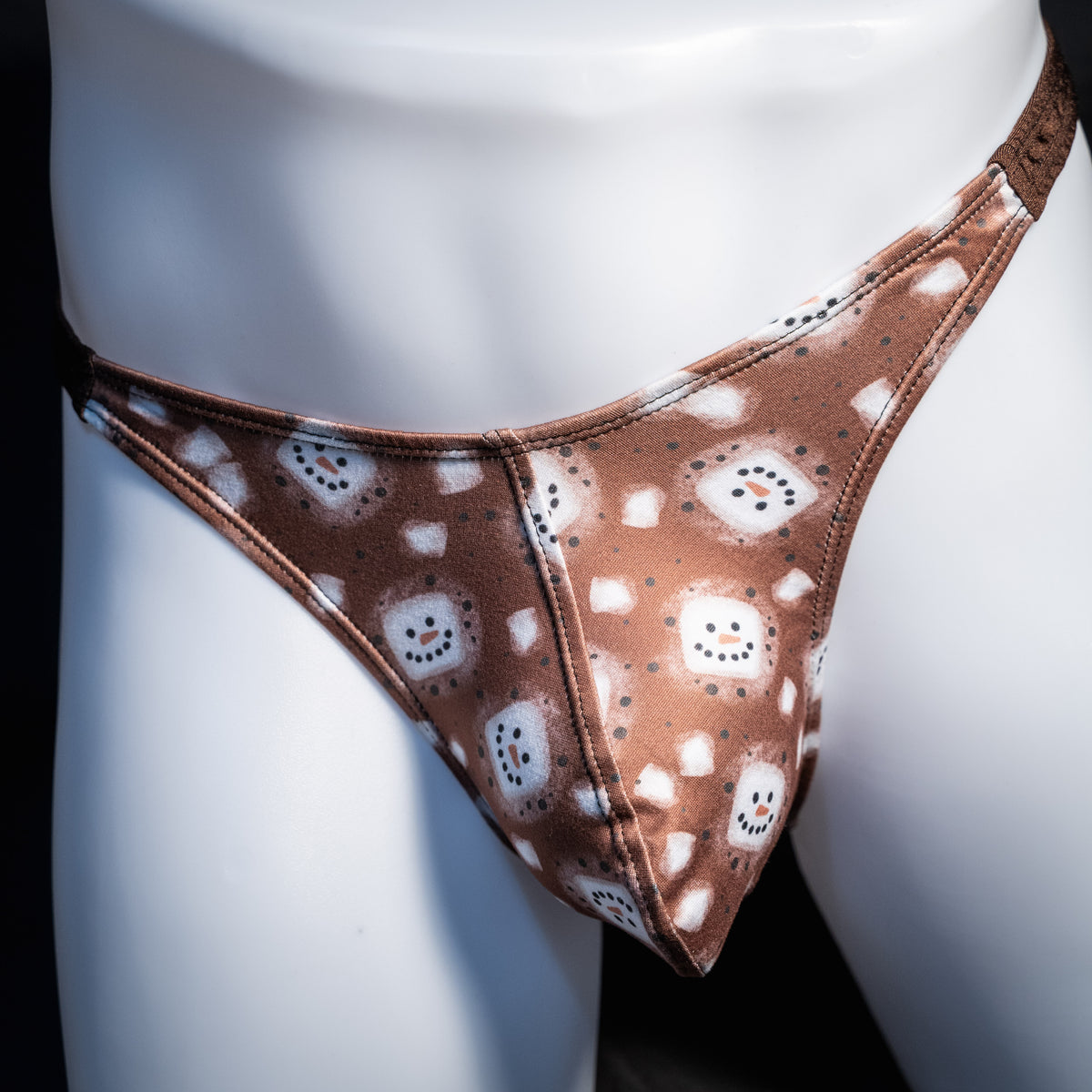 Men's hot chocolate snowmen themed thong underwear, classic cut, front view.
