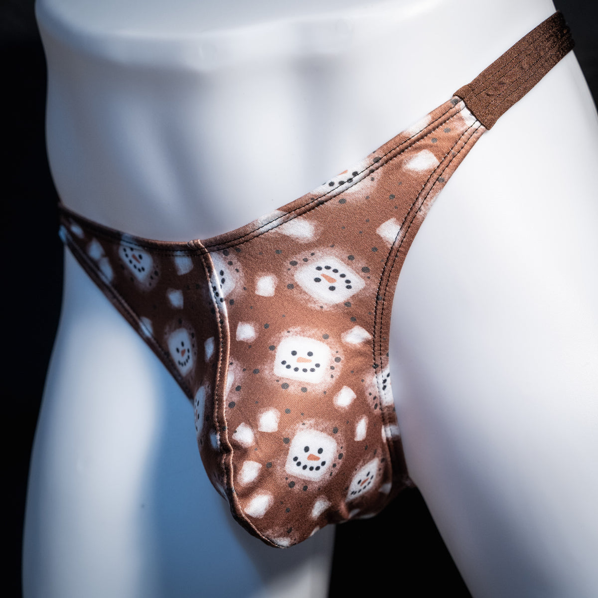 Men's hot chocolate snowmen themed thong underwear, classic cut, front view.