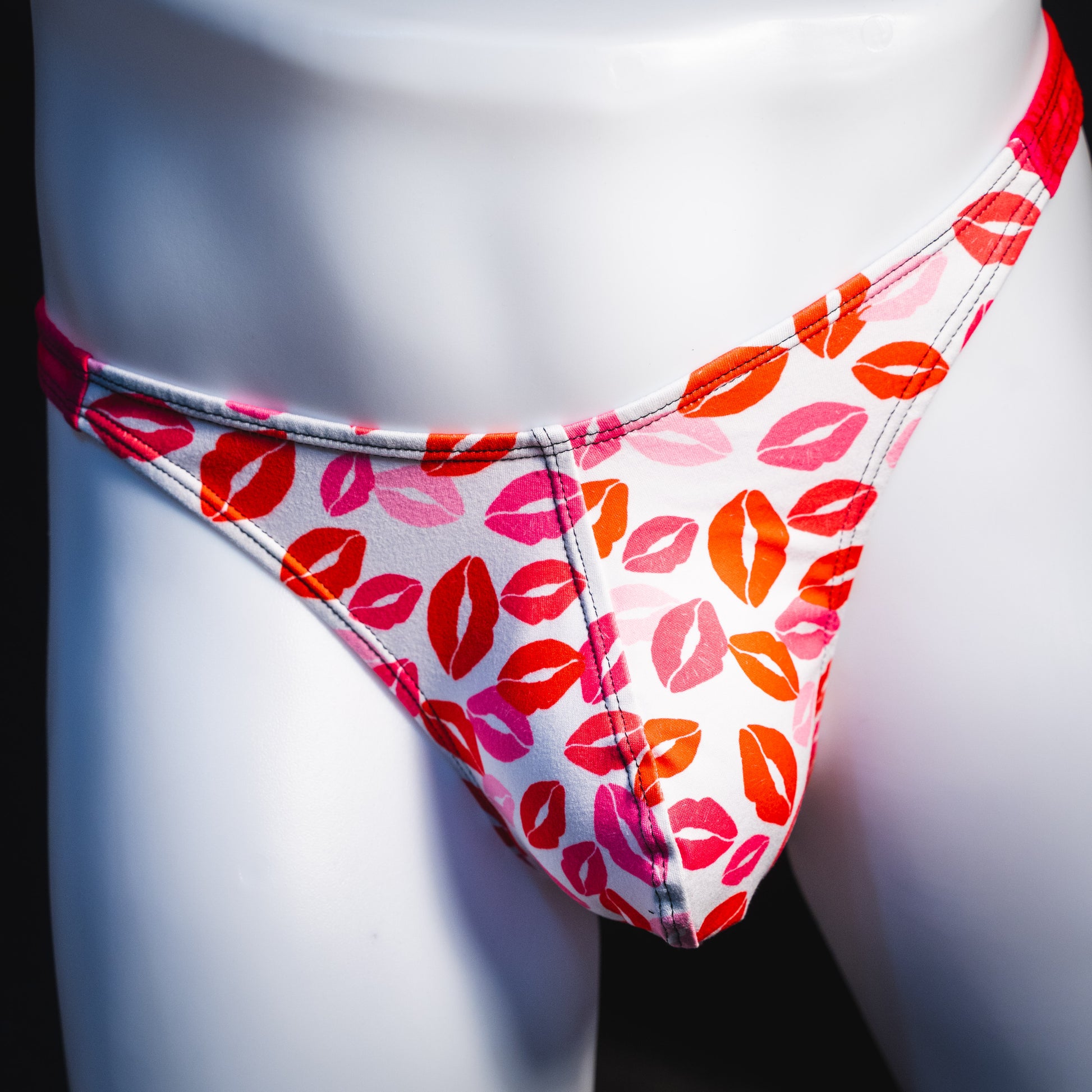 Men's Valentine's Day lips thong underwear, classic cut, front view.