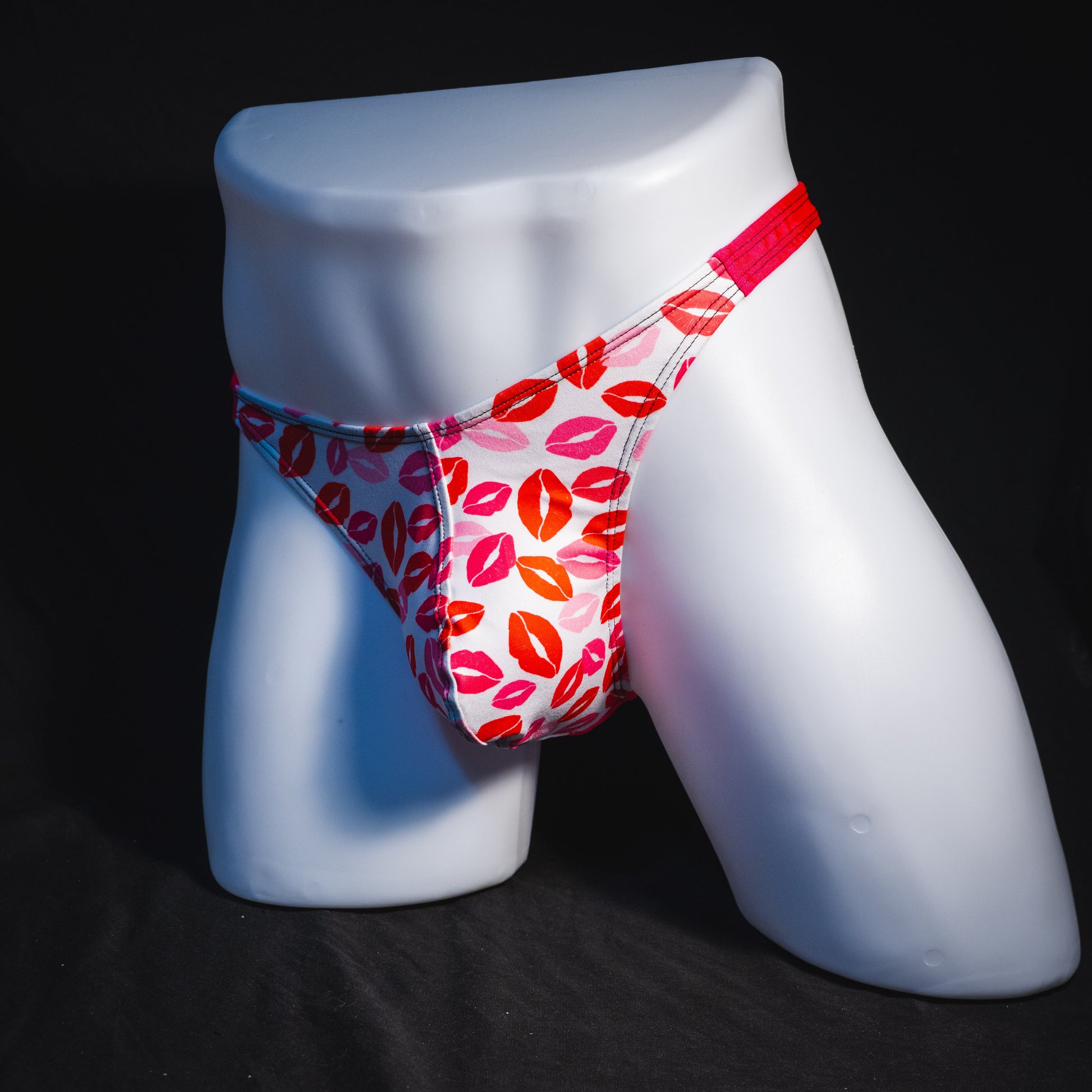 Men's Valentine's Day lips thong underwear, classic cut, full angled front view.