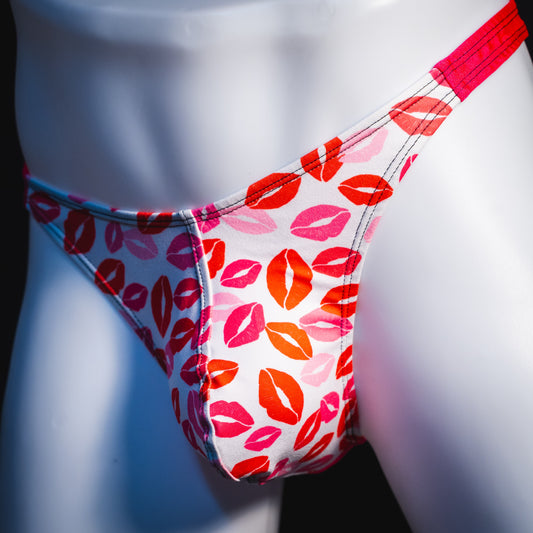 Men's Valentine's Day lips thong underwear, classic cut, front angled view.