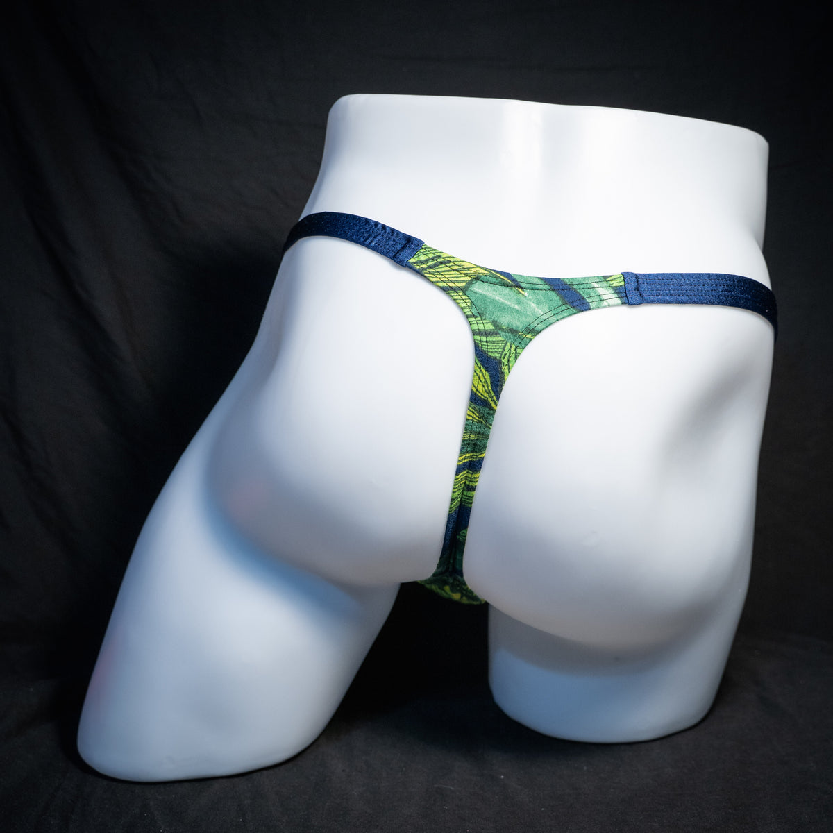 Men's jungle leaves thong underwear, classic cut, rear view.