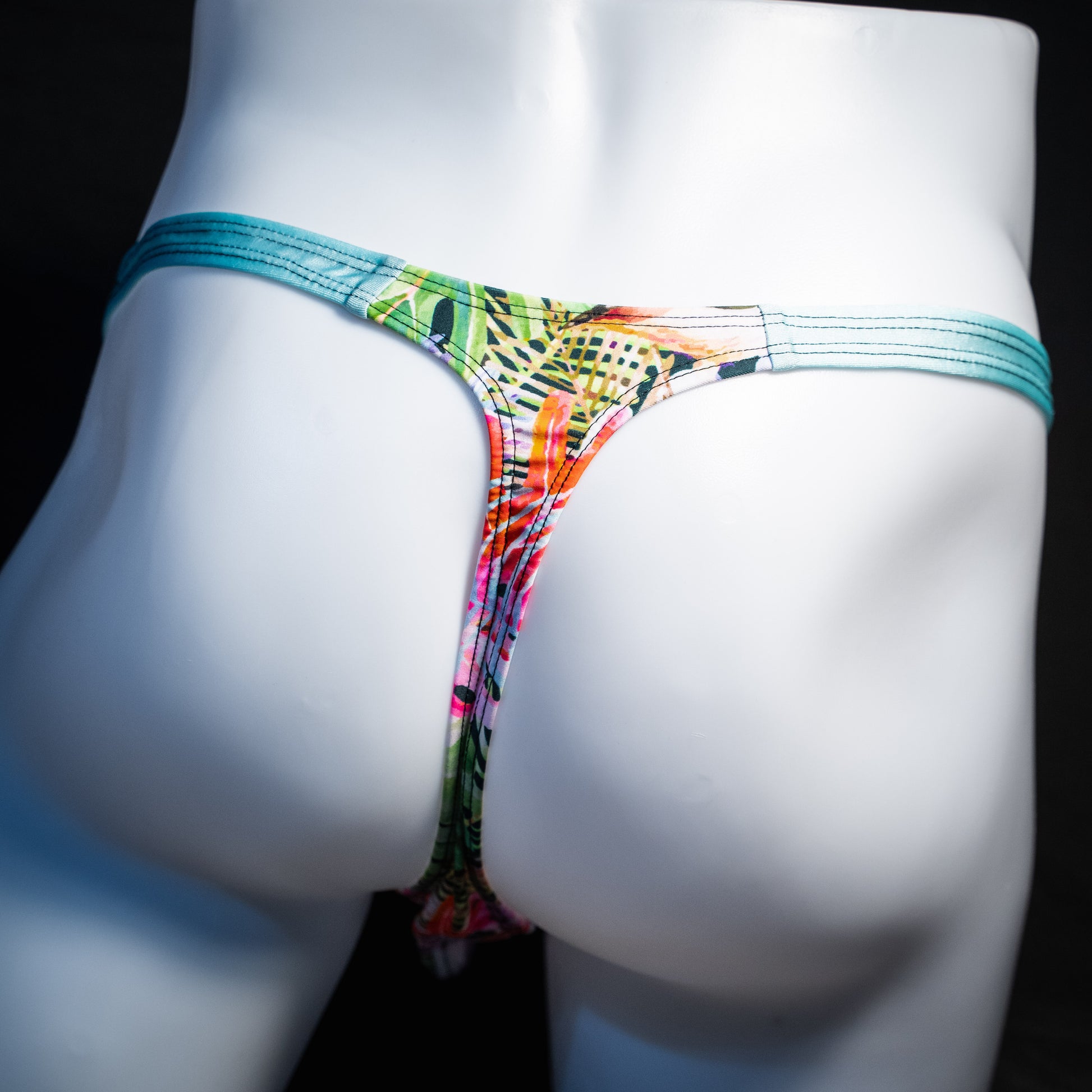 Men's jungle pattern thong underwear, classic cut, rear view.