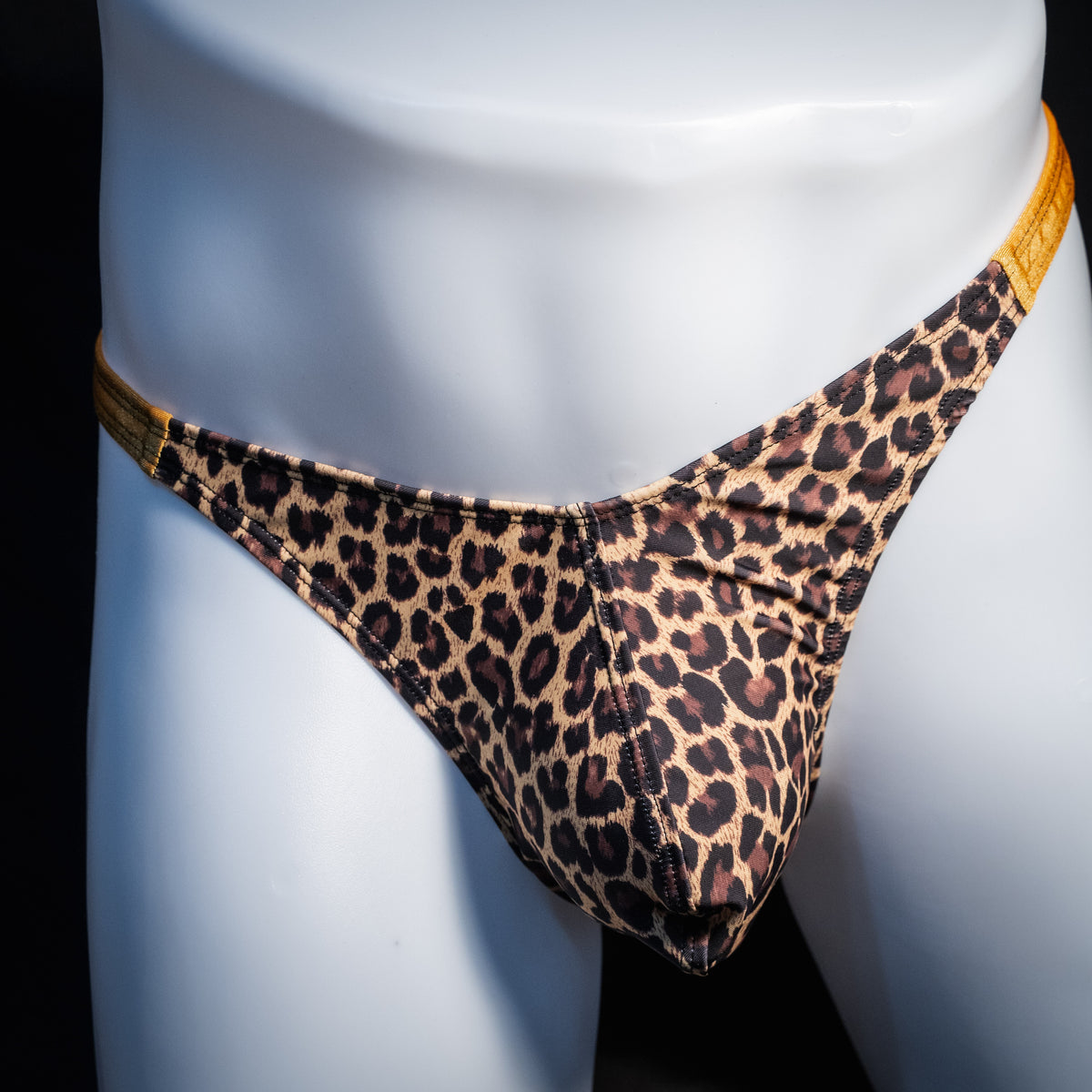 Men's leopard print thong underwear, classic cut, front view.