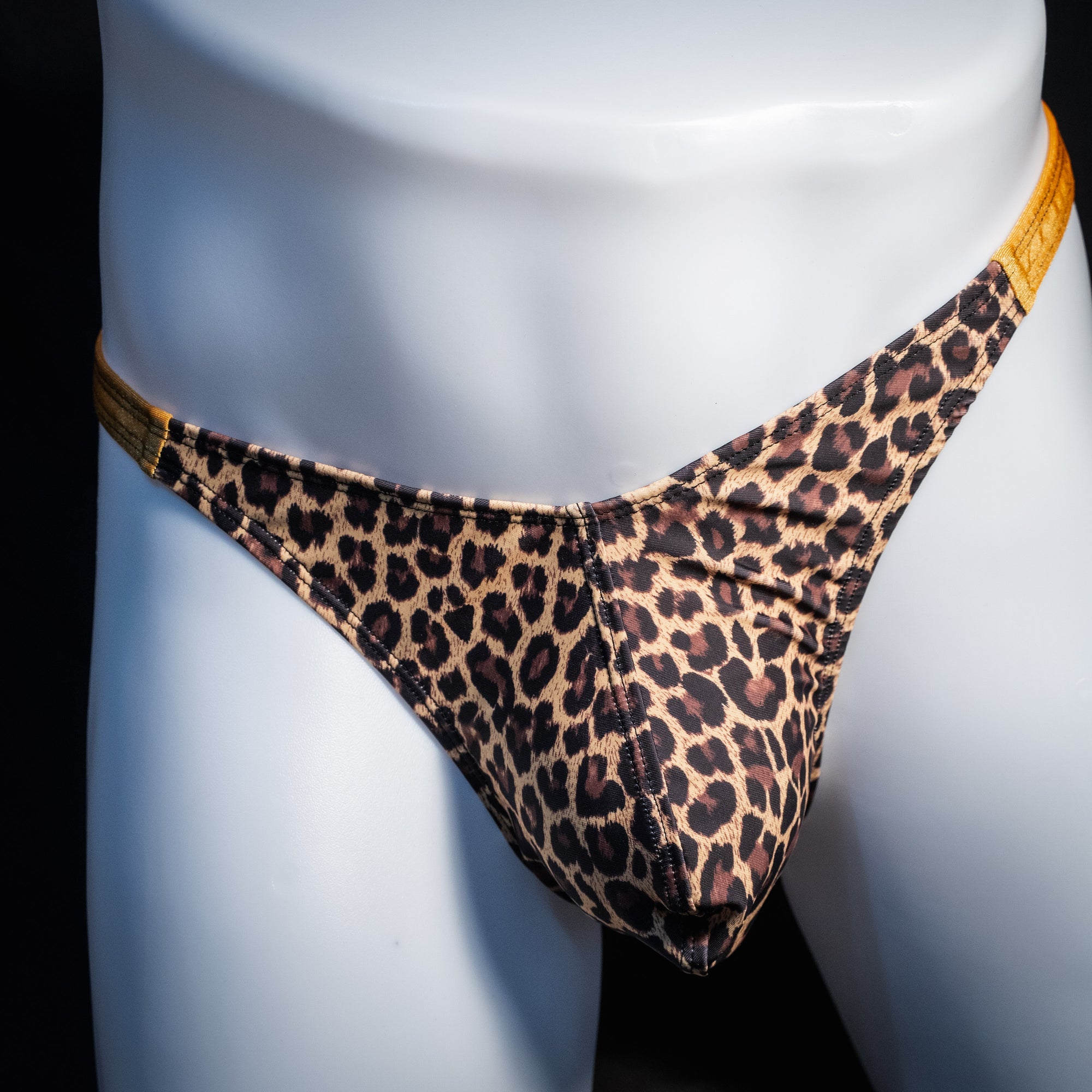 Men's leopard print thong underwear, classic cut, front view.