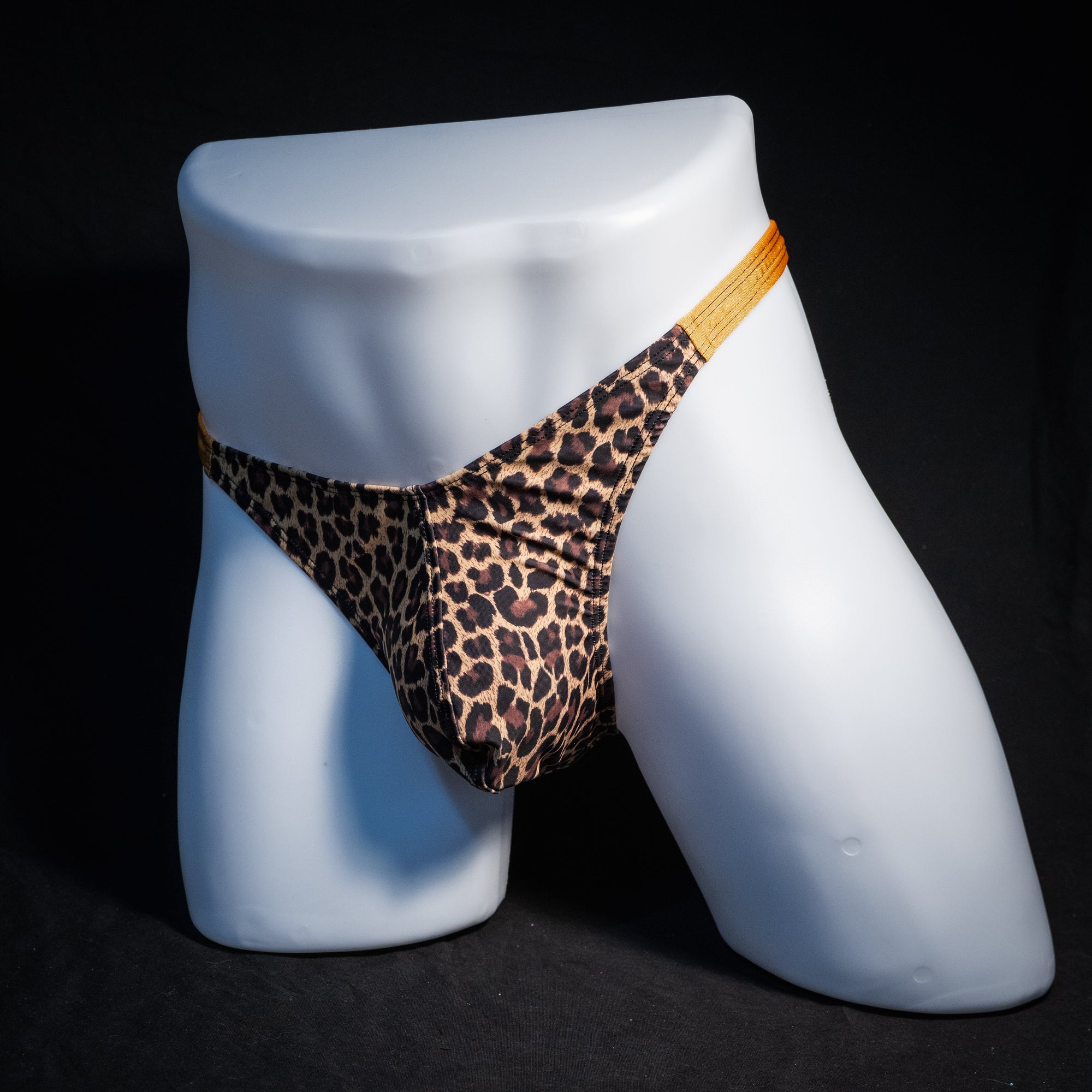 Men's leopard print thong underwear, classic cut, front view.