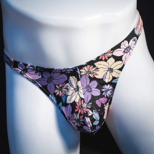 Men's purple floral with lilac straps thong underwear, classic cut, front view.