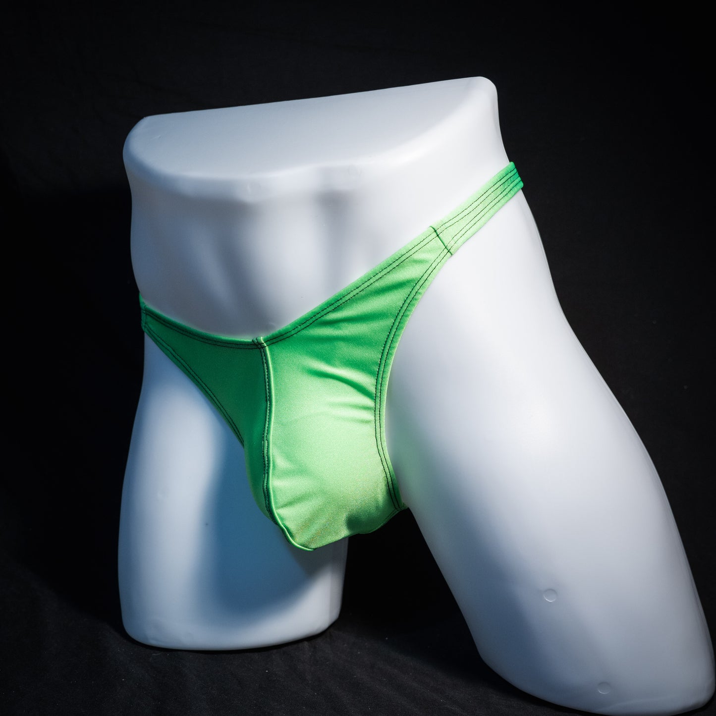 Men's lime green thong underwear, classic cut, front view.