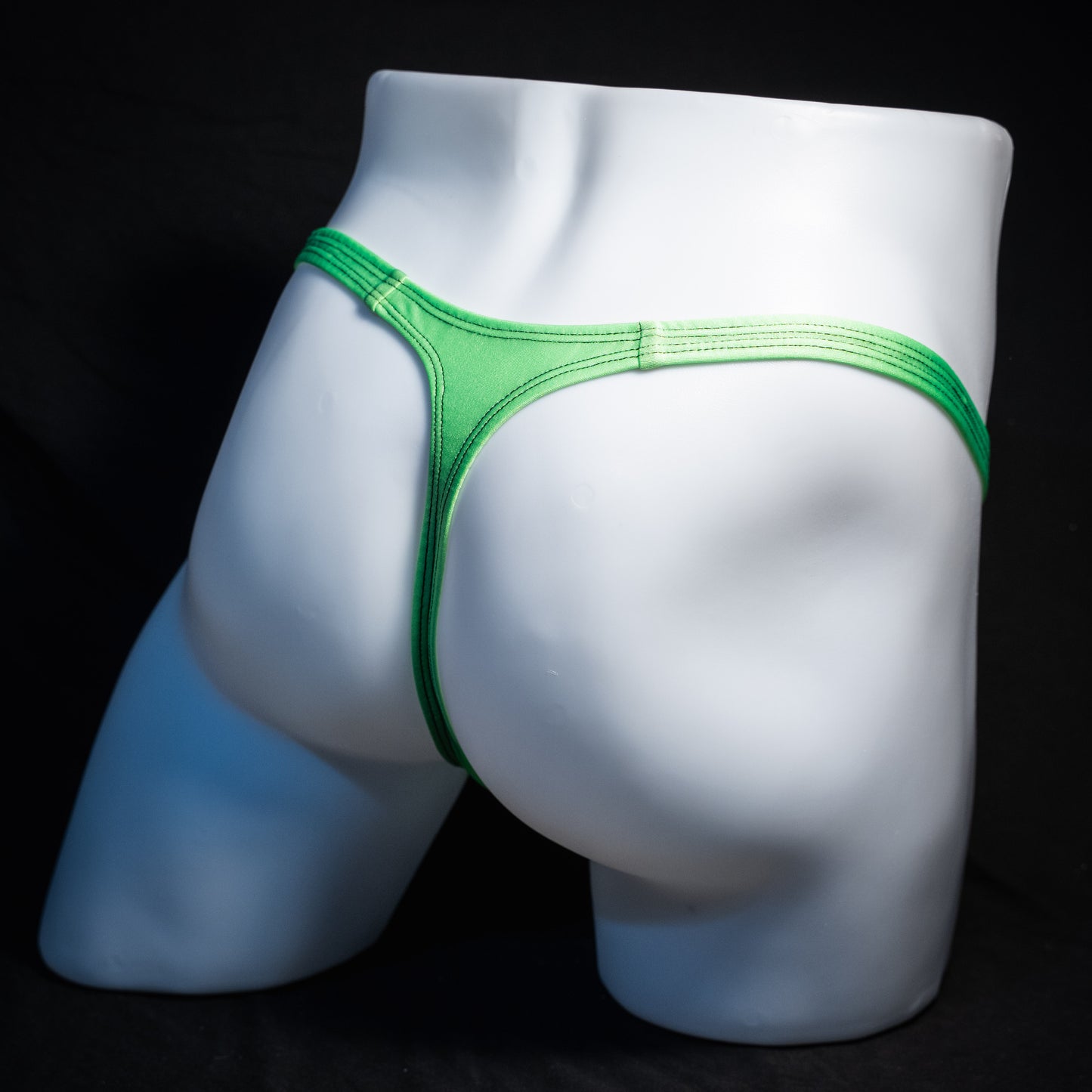 Men's lime green thong underwear, classic cut, rear view.