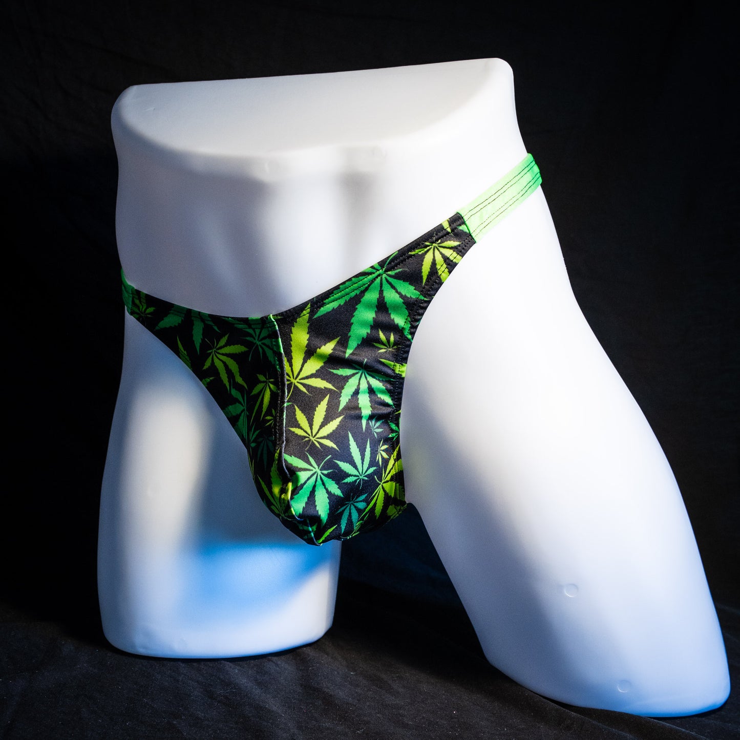 Men's marijuana print thong underwear, classic cut, full front angled view.