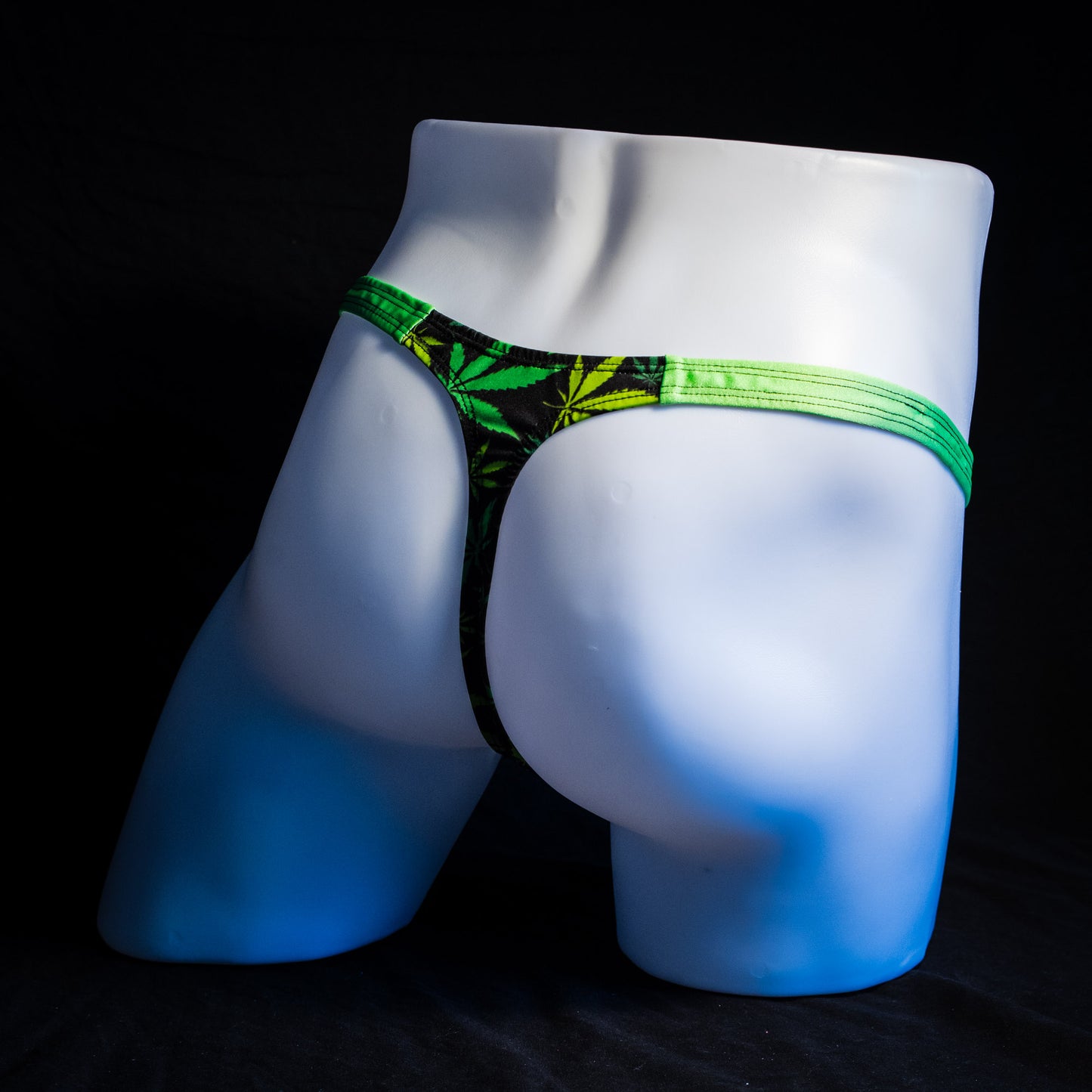 Men's marijuana print thong underwear, classic cut, full angled rear view.