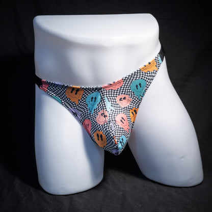 Men's melting faces thong underwear, classic cut, front view.
