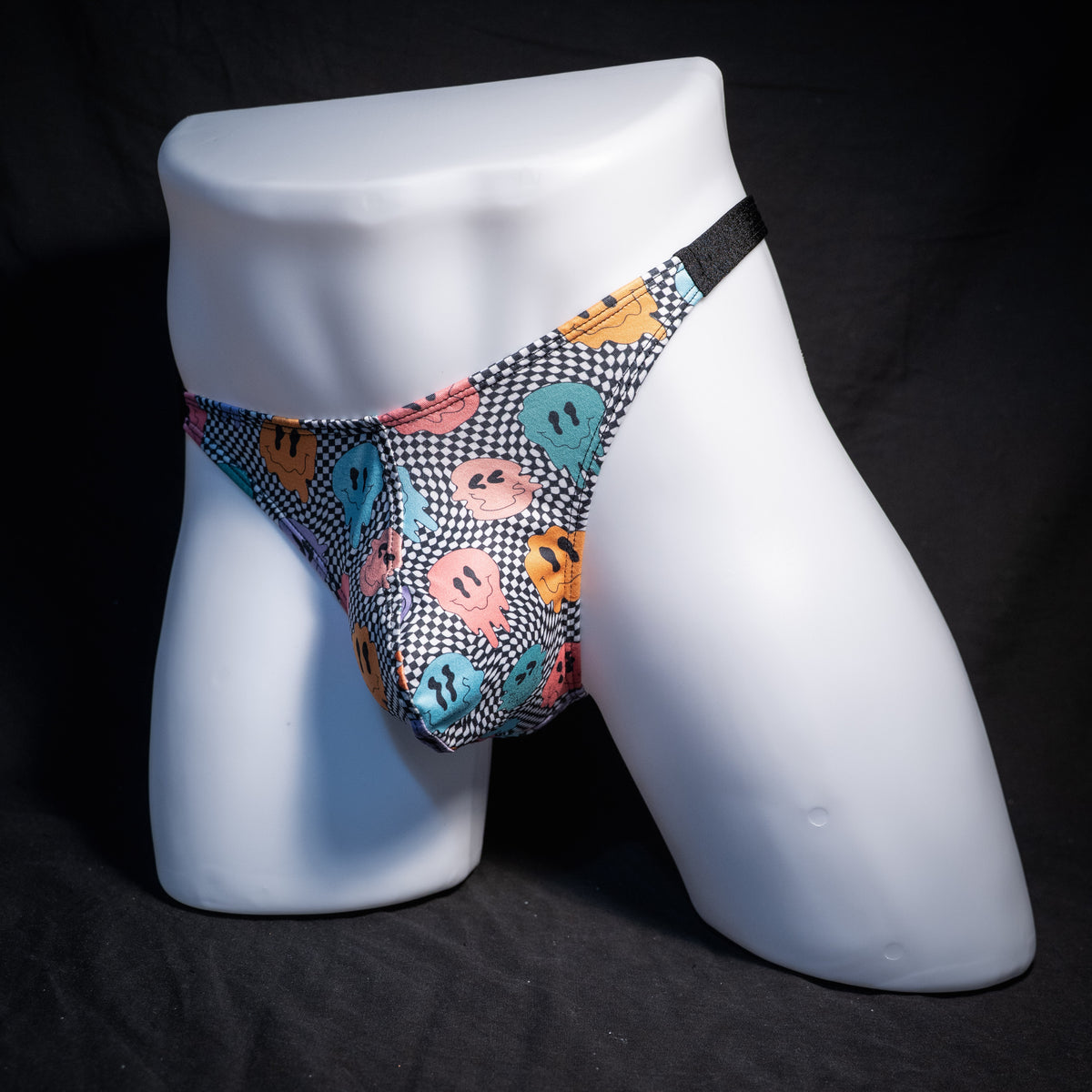 Men's melting faces thong underwear, classic cut, front view.