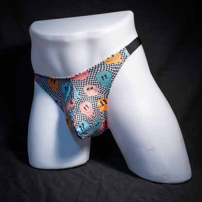 Men's melting faces thong underwear, classic cut, front view.